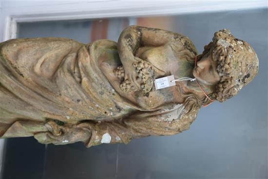 A Victorian terracotta figure of a classical muse holding grapes, H.4ft3in.